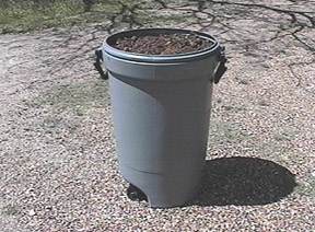 Plastic trash can for wood/leaf mulch storage - Image  C. Campbell